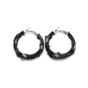 Broken fabric covered hoop earrings