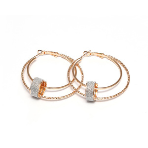Gold tone double hoop earrings with silver glitter...