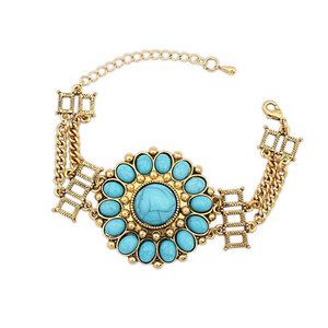 Antique gold tone Bohemian ethnic style bracelet with blue flower