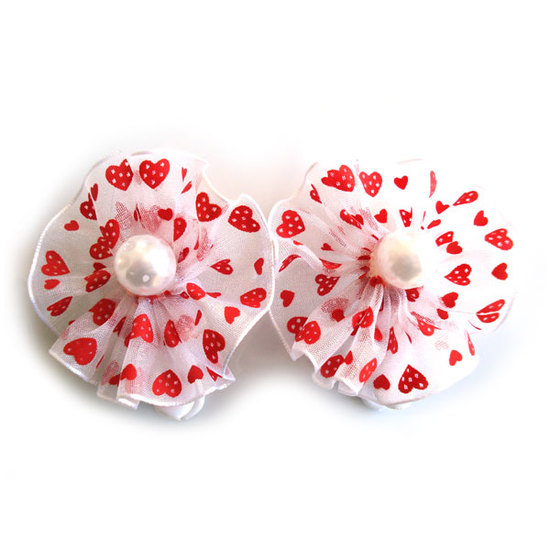Pair of red and white textured bow hair clips