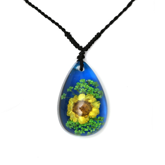 Yellow pressed flower in blue resin teardrop pendant...