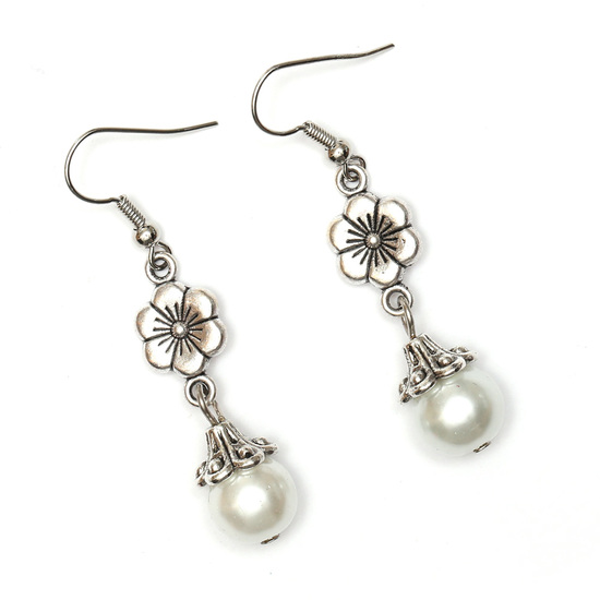 White glass pearl beads with Tibetan style silver tone flower drop earrings